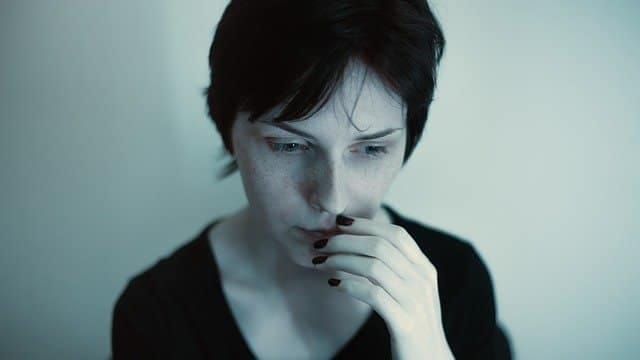 Hypnotherapy for anxiety Anxious woman with her hand over her mouth