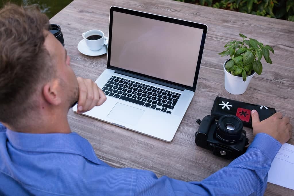 Man sitting at a laptop on a video call