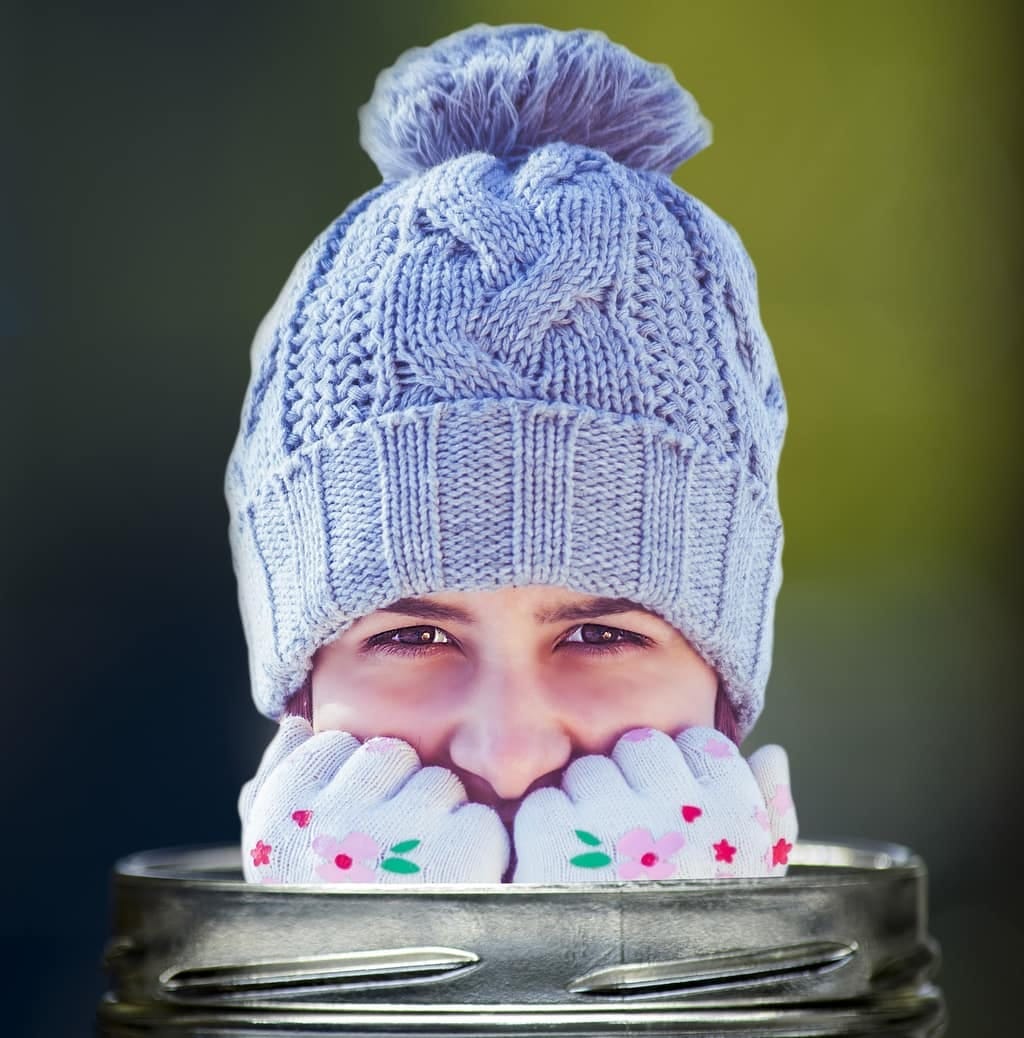 Person hiding their face in a woolly hat